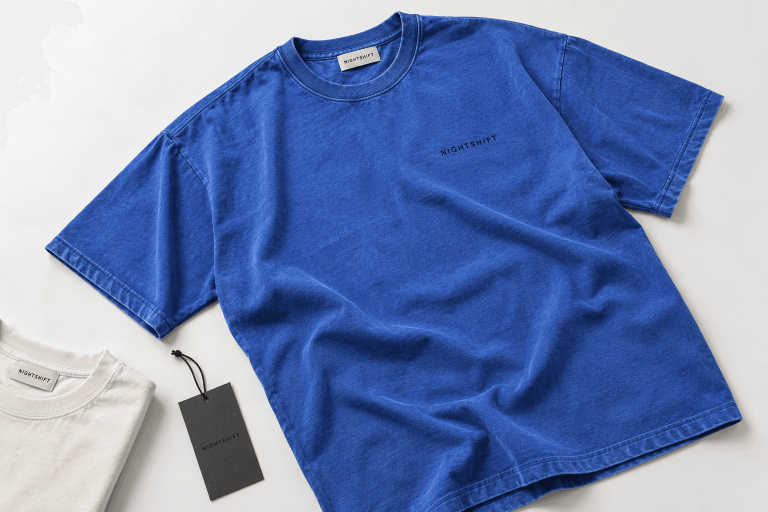 NIGHTSHIFT concept: a cobalt blue heavyweight T-shirt with a matching hang tag